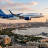 Самолёт Azerbaijan Airlines над Баку и побережьем Каспийского моря