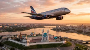 Пассажирский самолёт над Казанью в вечернем свете